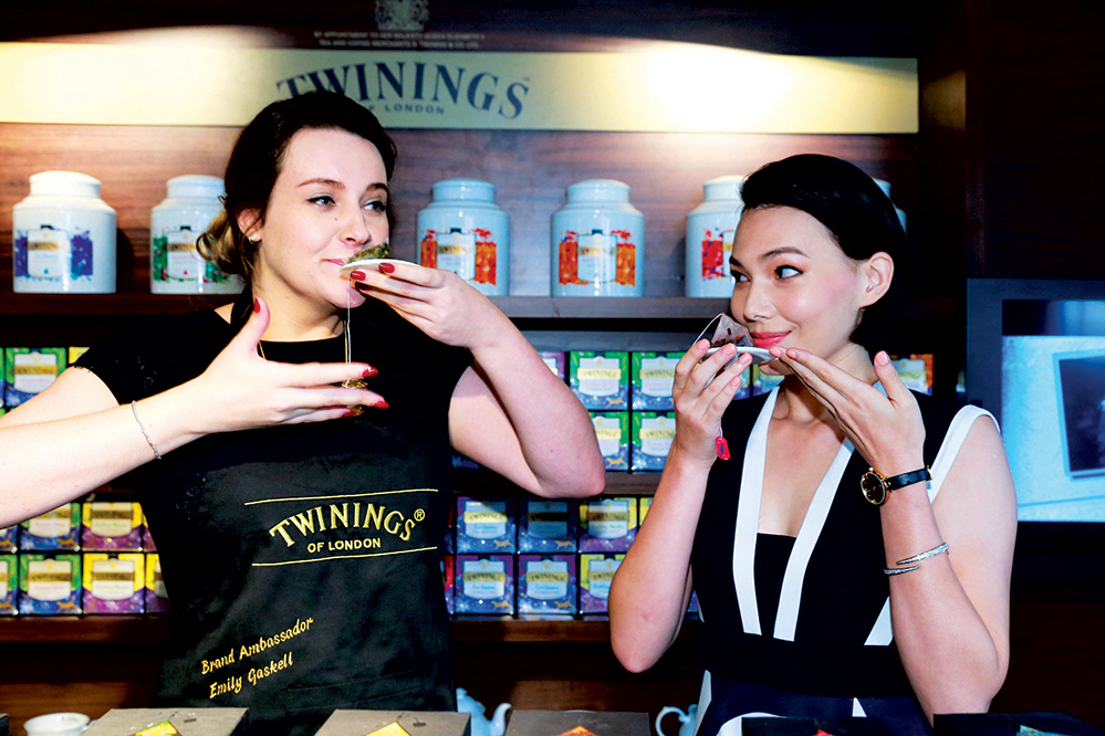Twinings ambassador Emily Gaskell tasting tea with Taiwanese actor Teresa Daley